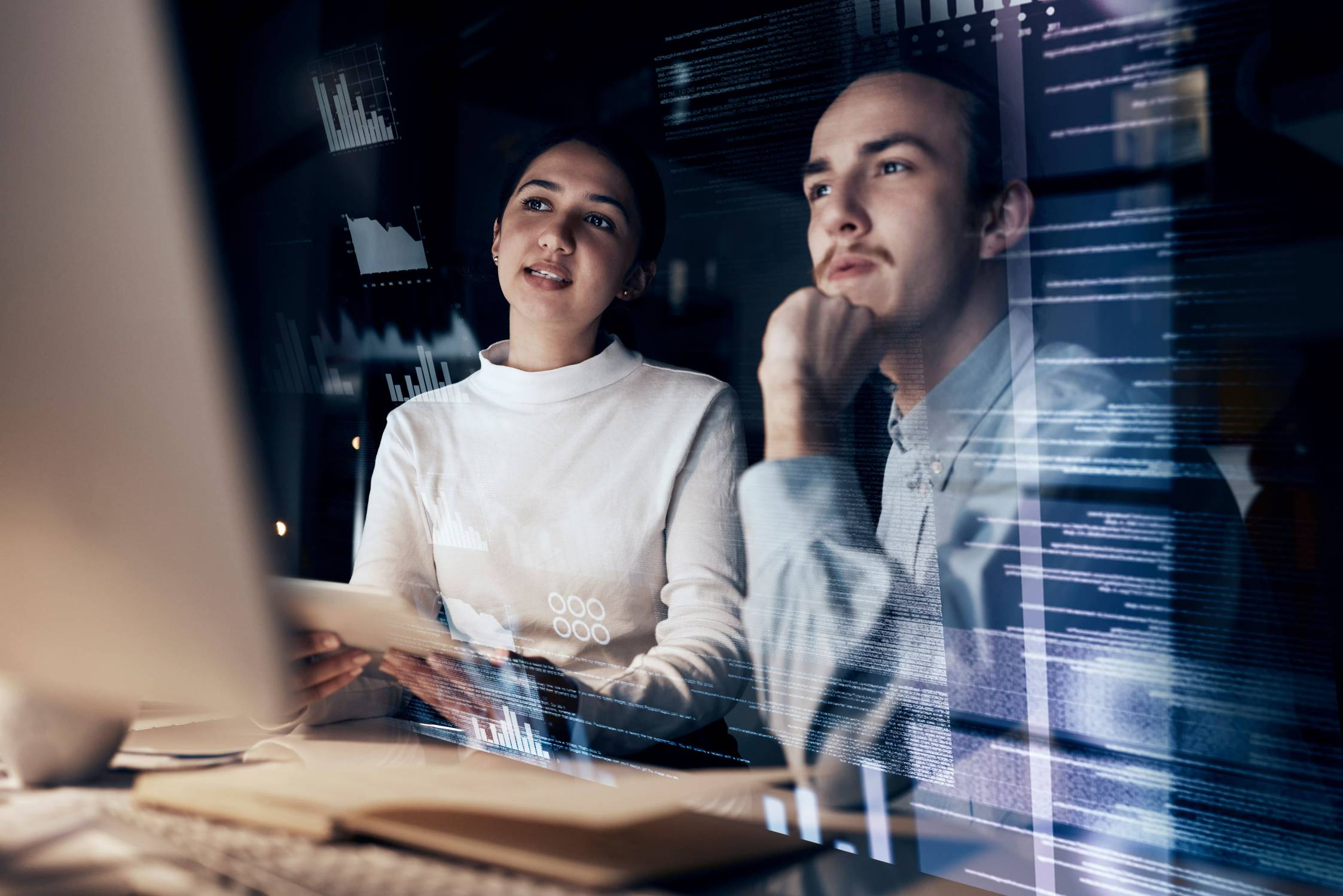 Two people working with technology